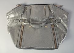 A GOOD YVES ST. LAURENT SILVER/METALLIC LEATHER BAG. 1ft 6in long overall, 1ft high.