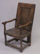 AN 18TH CENTURY OAK PANEL BACK ARMCHAIR with solid seat on stretchered turned legs. 3ft 6ins high