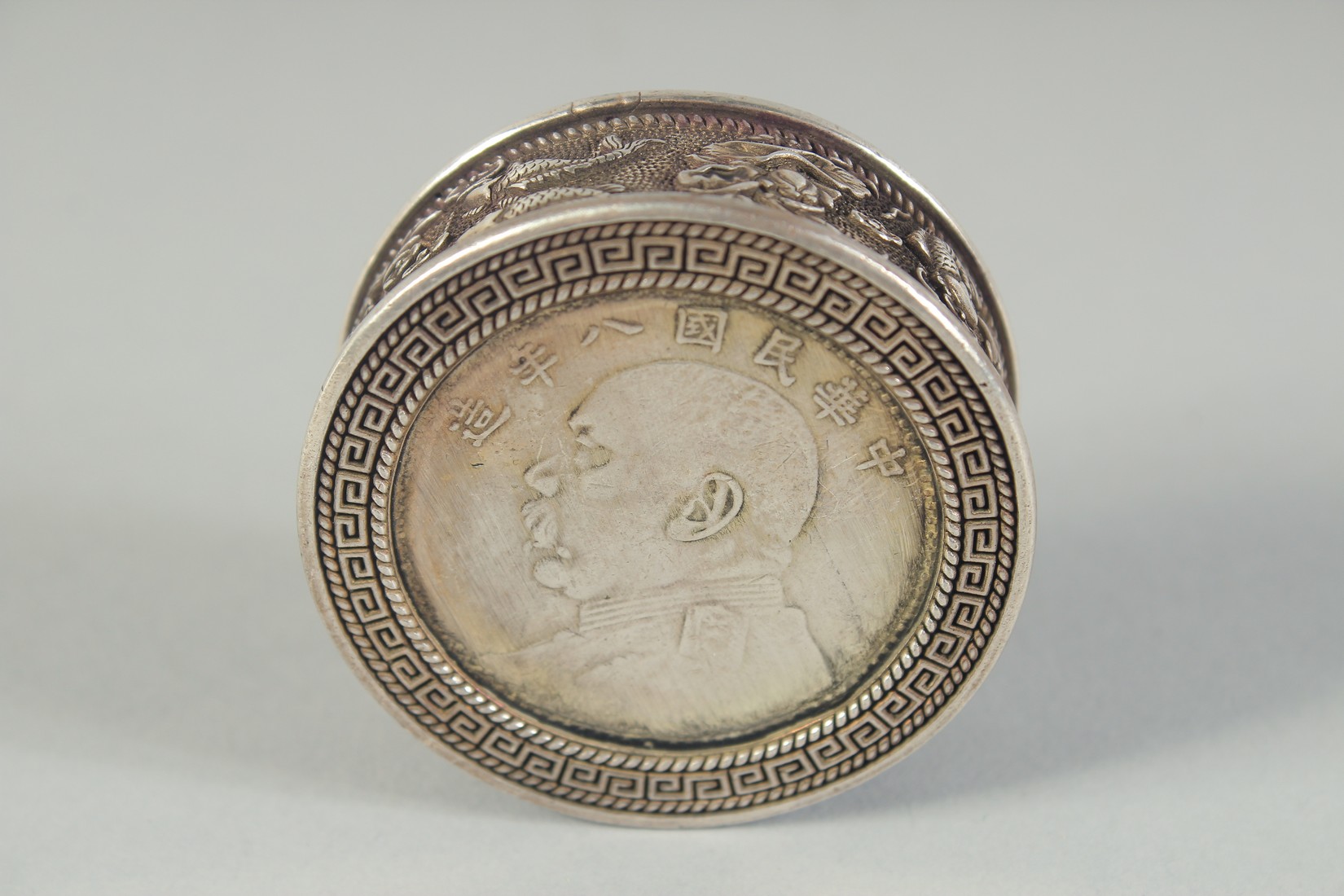 A CHINESE WHITE METAL COIN BOX. 1.75ins diameter. - Image 3 of 4