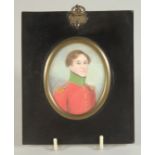 19TH CENTURY IRISH SCHOOL. PORTRAIT MINIATURE OF A YOUNG MAN in a red uniform coat. 3ins x 2.25ins