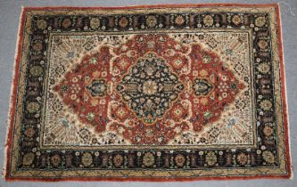 A PERSIAN PART SILK RUG with a stylised floral decoration. 135cm x 81cm.
