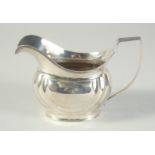 A GEORGE III SILVER CREAM JUG. London 1806. Maker: S. L.& E. D.