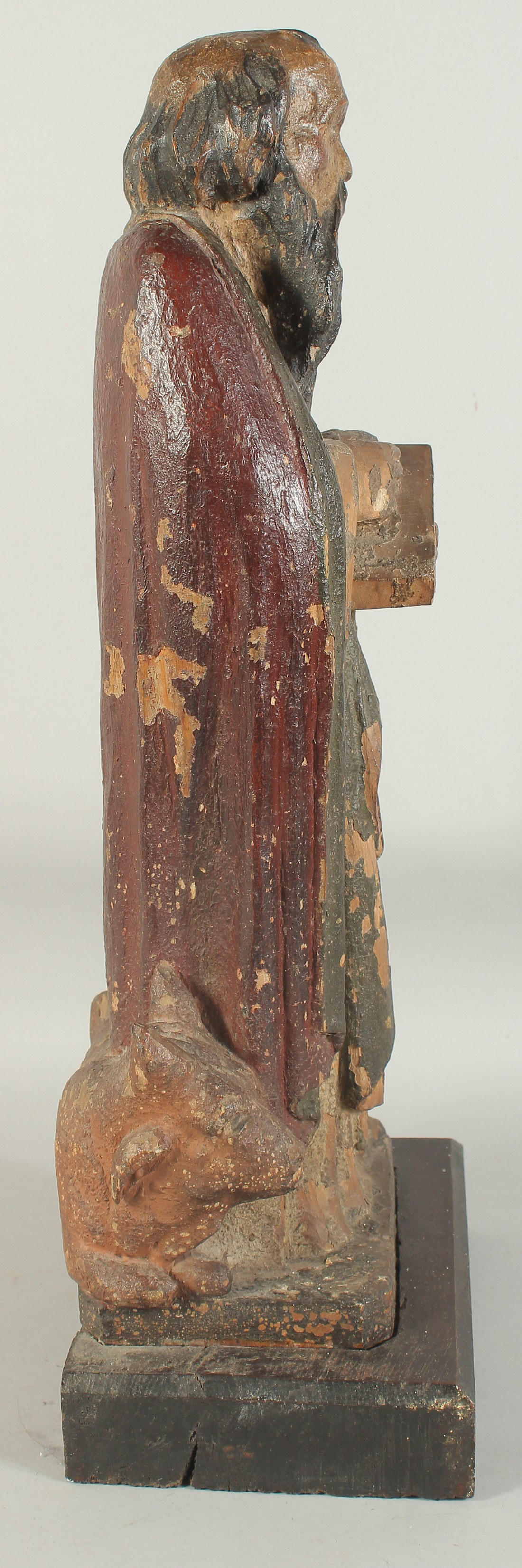 A GOOD 17TH CENTURY CARVED WOOD AND POLYCHROME FIGURE, ST. LUC, on a wooden base. 1ft 11ins high. - Image 5 of 7