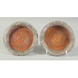 A GOOD PAIR OF EUROPEAN 19TH CENTURY WHITE METAL CIRCULAR WINE COASTERS with foliate edges and