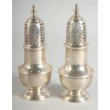 A PAIR OF GEORGE III SILVER SAM WOOD CASTERS. London 1777 & 1779.