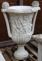 A LARGE PAIR OF ITALIAN CARVED WHITE MARBLE TWO HANDLED URNS. The sides carved with cupids depicting