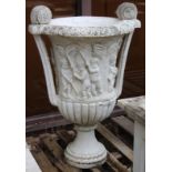 A LARGE PAIR OF ITALIAN CARVED WHITE MARBLE TWO HANDLED URNS. The sides carved with cupids depicting