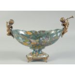 A PORCELAIN AND BRONZE OVAL BOWL with cherub handles. 4ft long.