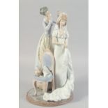 A LARGE LLADRO PORCELAIN GROUP "THE WEDDING VEIL, MY WEDDING DAY". No. 1494. 15.5ins high, issued