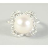 A GOOD 18CT WHITE GOLD PEARL AND DIAMOND RING.