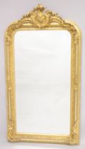 A LARGE GILTWOOD MIRROR. 5ft 2ins high, 2ft 9ins wide.