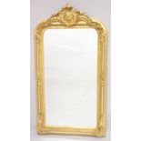 A LARGE GILTWOOD MIRROR. 5ft 2ins high, 2ft 9ins wide.