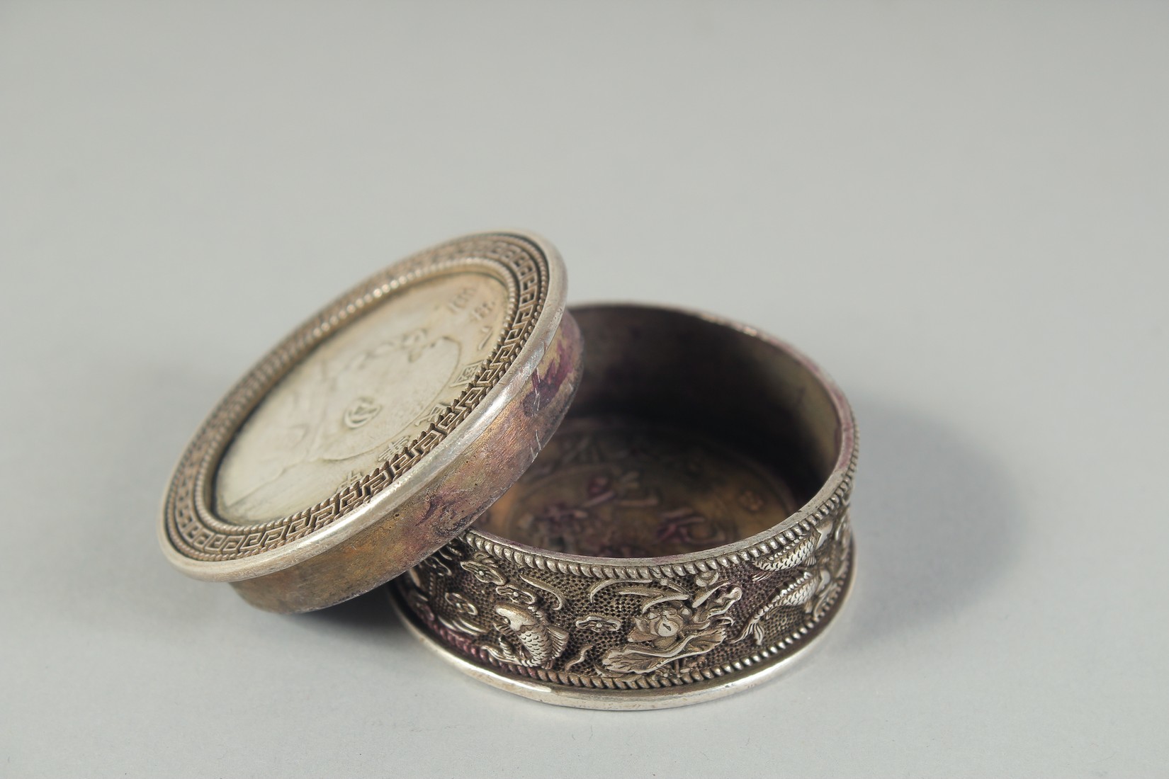 A CHINESE WHITE METAL COIN BOX. 1.75ins diameter. - Image 4 of 4