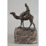 A GOOD AUSTRIAN BRONZE OF AN ARAB RIDING A CAMEL. 5.5ins high on a marble base.