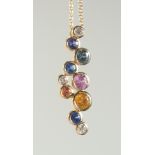 A GOOD 18CT GOLD MULTI SAPPHIRE AND DIAMOND PENDANT, one gold chain.