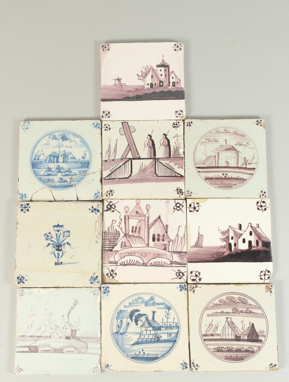 A COLLECTION OF TEN EARLY DELFT MANGANESE AND BLUE AND WHITE TILES. 13cm x 13cm.