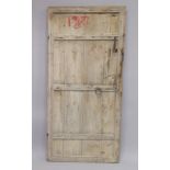 AN OLD RUSTIC DOOR 5ft 6ins high, 2ft 6ins wide.