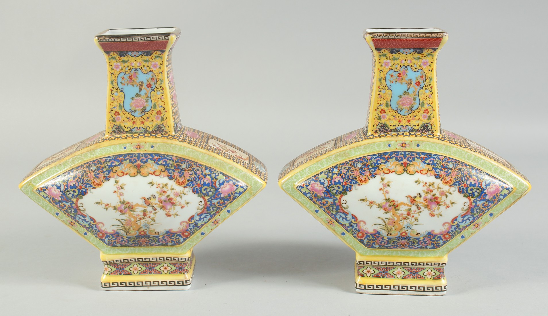 A PAIR OF CHINESE PORCELAIN FAN SHAPED VASES. 8.5ins high.