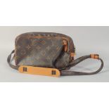 A LOUIS VUITTON SHOULDER BAG. 9ins long, 5.5ins long.