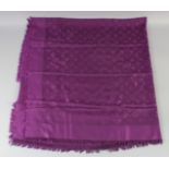 A LOUIS VUITTON PURPLE SHAWL with Louis Vuitton emblems. 140cm 120cm.