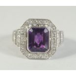 AN 18CT WHITE GOLD AMETHYST AND DIAMOND RING.