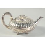 A GEORGE III SILVER CIRCULAR FLUTED TEA POT on three pad feet. London 1819. Maker Nathan & Hayes.