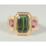 A GOOD 18CT GOLD GREEN TOURMALINE AND DIAMOND RING.