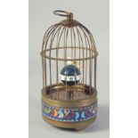 A SMALL REPLICA BIRD CAGE CLOCK. 7.5ins high.