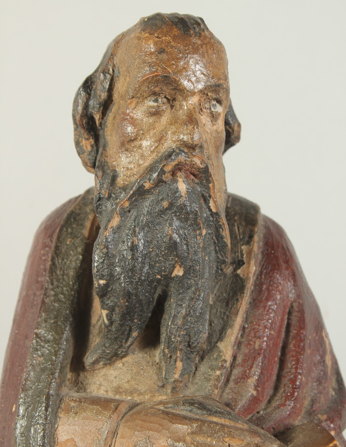 A GOOD 17TH CENTURY CARVED WOOD AND POLYCHROME FIGURE, ST. LUC, on a wooden base. 1ft 11ins high. - Image 2 of 7