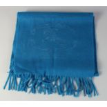A BURBERRY BLUE CASHMERE SCARF with horse and rider design, 4ft long.
