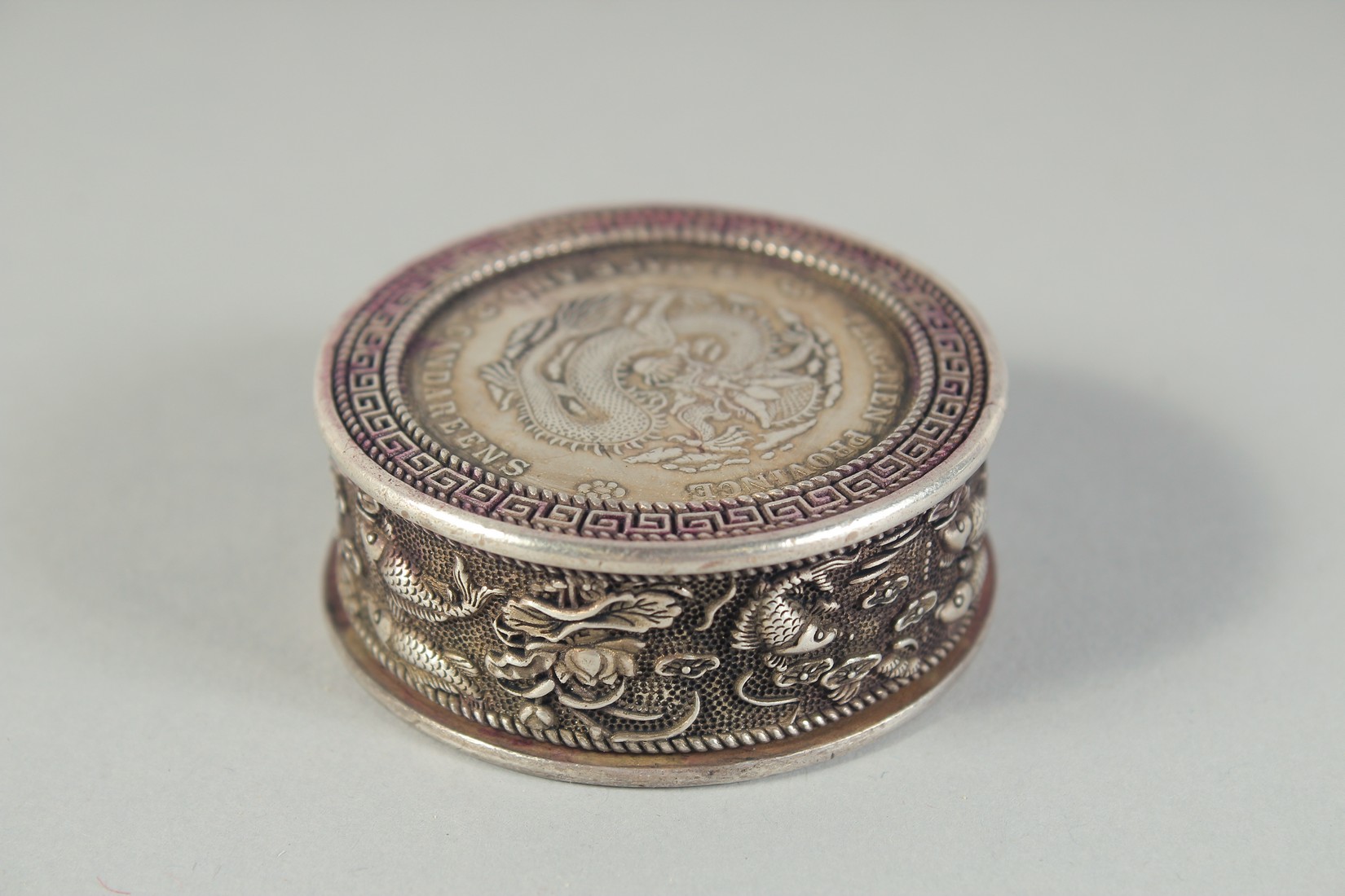 A CHINESE WHITE METAL COIN BOX. 1.75ins diameter. - Image 2 of 4