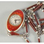 A PLO. JOUZ GENEVA SILVER AND RED ENAMEL OVAL WATCH on a chain.