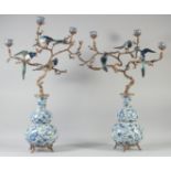 A VERY GOOD PAIR OF PORCELAIN AND GILT METAL BIRD DOUBLE GOURD VASES with branches and birds.