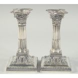 A GOOD PAIR OF VICTORIAN CORINTHIAN COLUMN CANDLESTICKS with bead edge. 6.5ins high. Sheffield 1900.