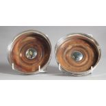 A PAIR OF PLAIN GEORGE III SILVER CIRCULAR WINE COASTERS with turned wood bases. 5.25ins diameter,