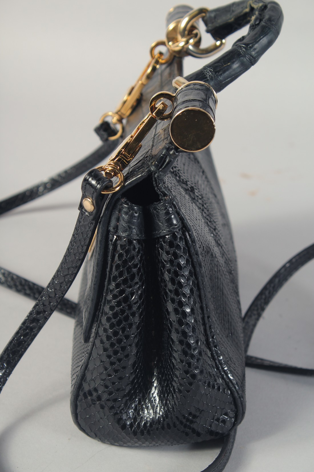 A GOOD DOLCE AND GABBANA BLACK CROCODILE OR SNAKESKIN BAG. 9ins long, 7ins high, in a dust bag. - Image 4 of 7