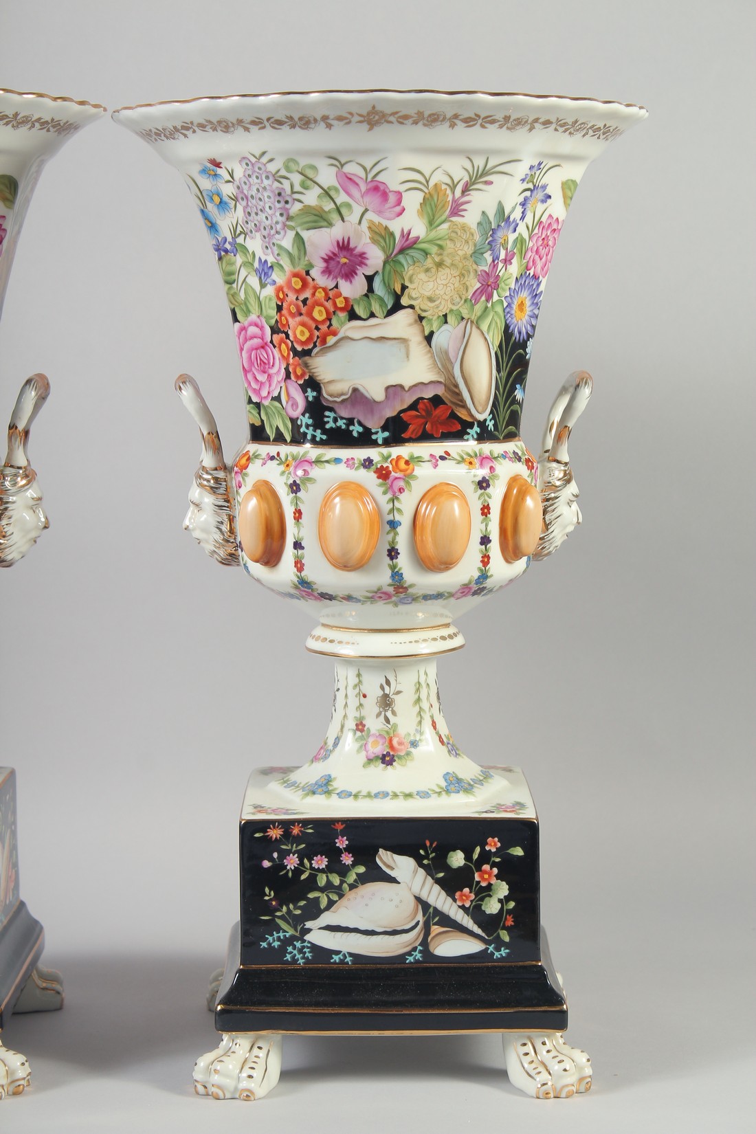 A GOOD LARGE PAIR OF CONTINENTAL TWO HANDLED URN SHAPED VASES ON STANDS on claw feet. 18ins high. - Image 3 of 4