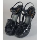 A PAIR OF YVES ST. LAURENT BLACK PATENT SHOES. Size 37.