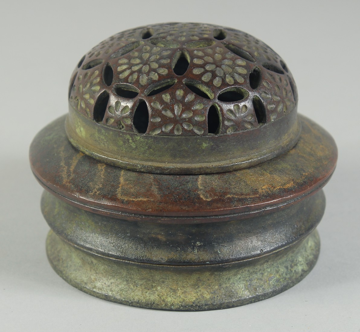 A CHINESE CIRCULAR BRONZE CENSER AND COVER. 4.5ins diameter.