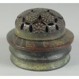 A CHINESE CIRCULAR BRONZE CENSER AND COVER. 4.5ins diameter.