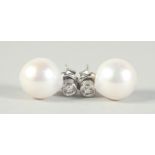 A PAIR OF 18CT WHITE GOLD AND PEARL DIAMOND DROP EARRINGS.