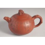 A CHINESE YIXING TEAPOT signed by Gu Jing Zhou, 16cm spout to handle.