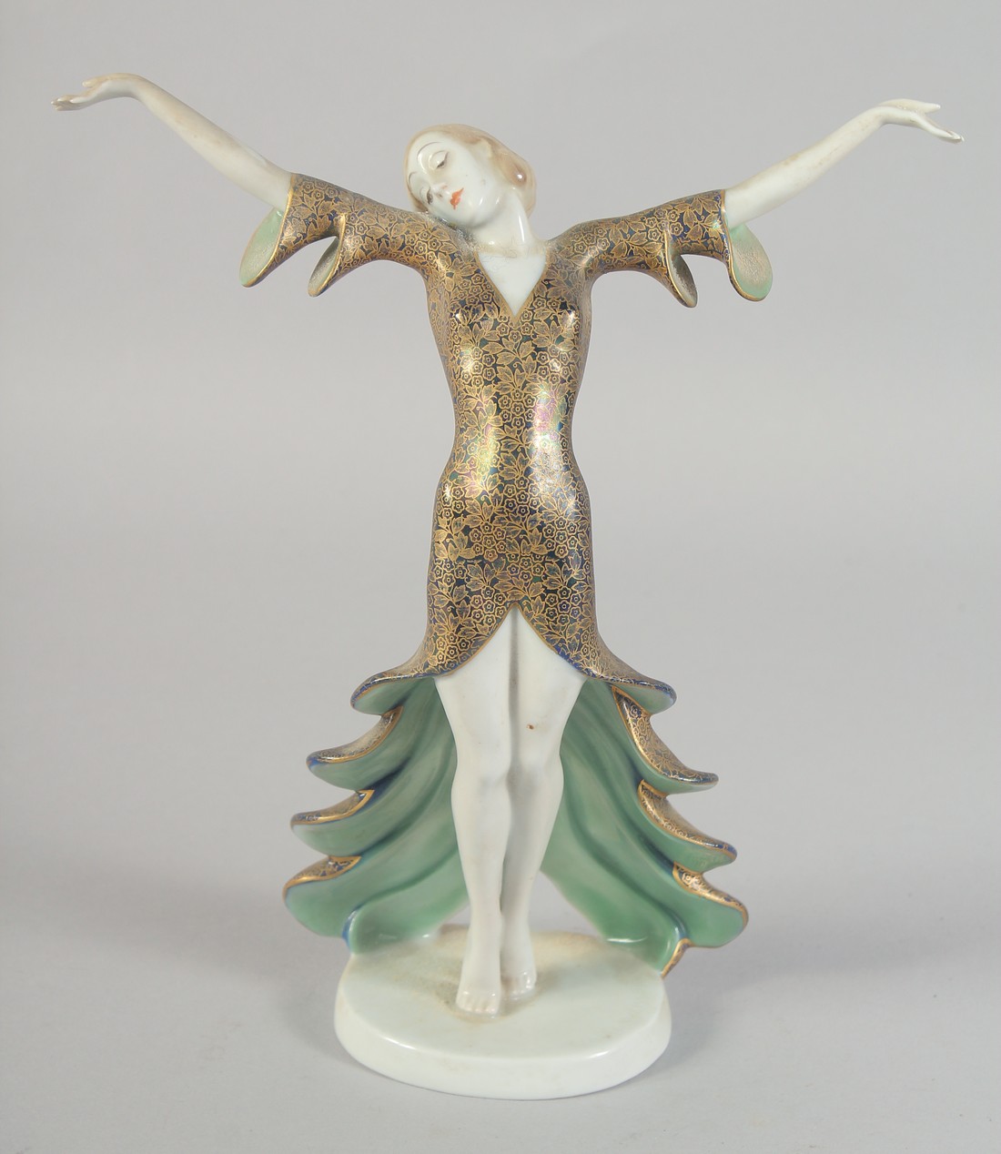 A ROSENTHAL ART DECO PORCELAIN DANCER arms outstretched. Bears original labels on base. 8.5ins