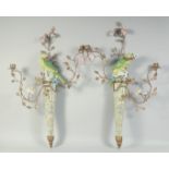 A GOOD LARGE PAIR OF PORCELAIN GILT METAL BIRDS AND FLOWERS WALL LIGHTS encrusted with flowers.