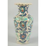 A PERSIAN POTTERY VASE. 11ins high.
