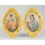 A PAIR OF SEVRES STYLE OVAL YELLOW WALL PLAQUES with portraits of a young lady. 1ft 3ins long.