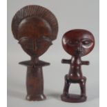 TWO FINELY CARVED AFRICAN WOODED FIGURES. 10.5ins and 8ins high.