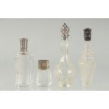 FOUR SILVER TOP SCENT BOTTLES.