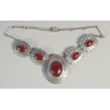 A GOOD STERLING SILVER NECKLACE set with four cabochon stones.