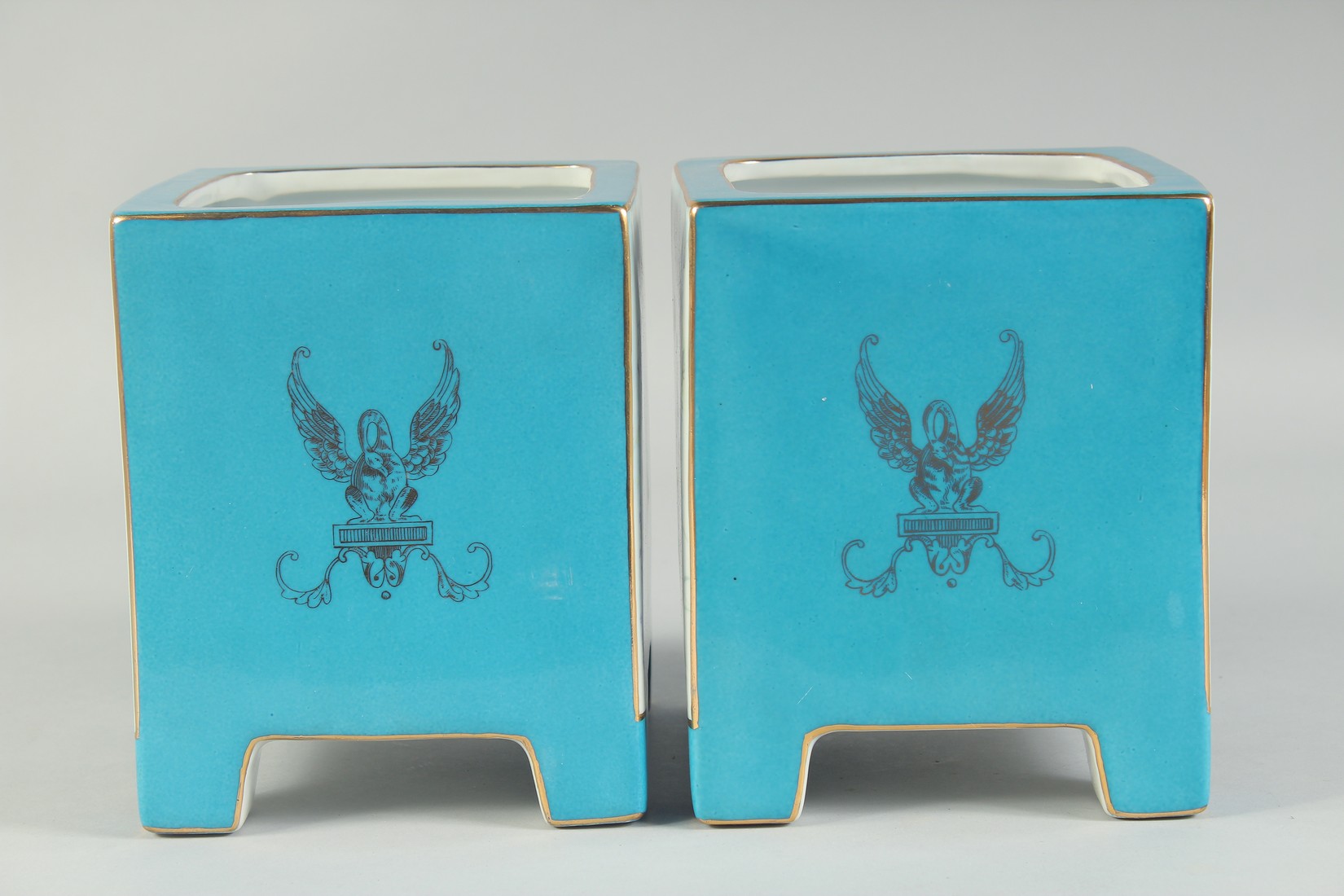 A PAIR OF SEVRES STYLE BLUE SQUARE CACHES POTS with panels of classical flowers. 7ins high. - Image 2 of 3